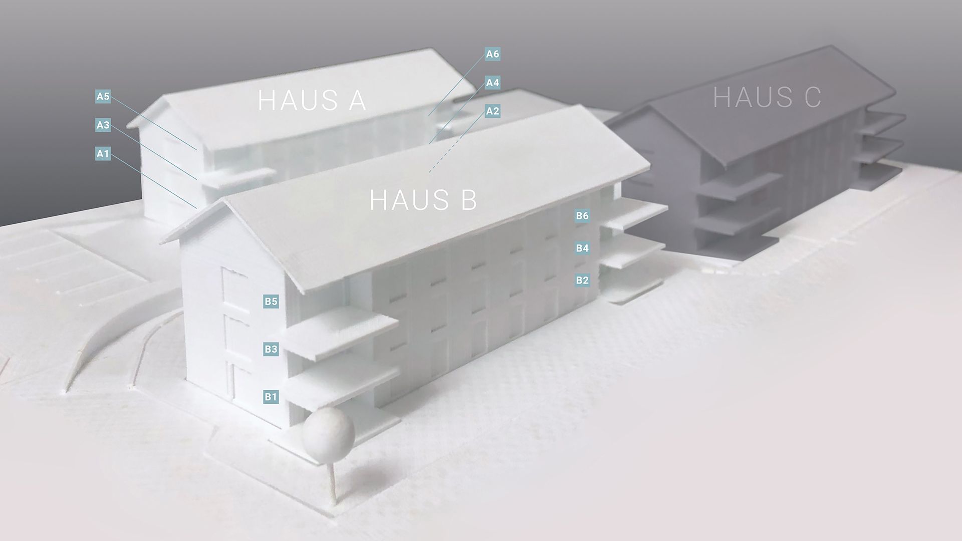 Modell der Überbauung mit Bezeichnung der einzelnen Wohnungen